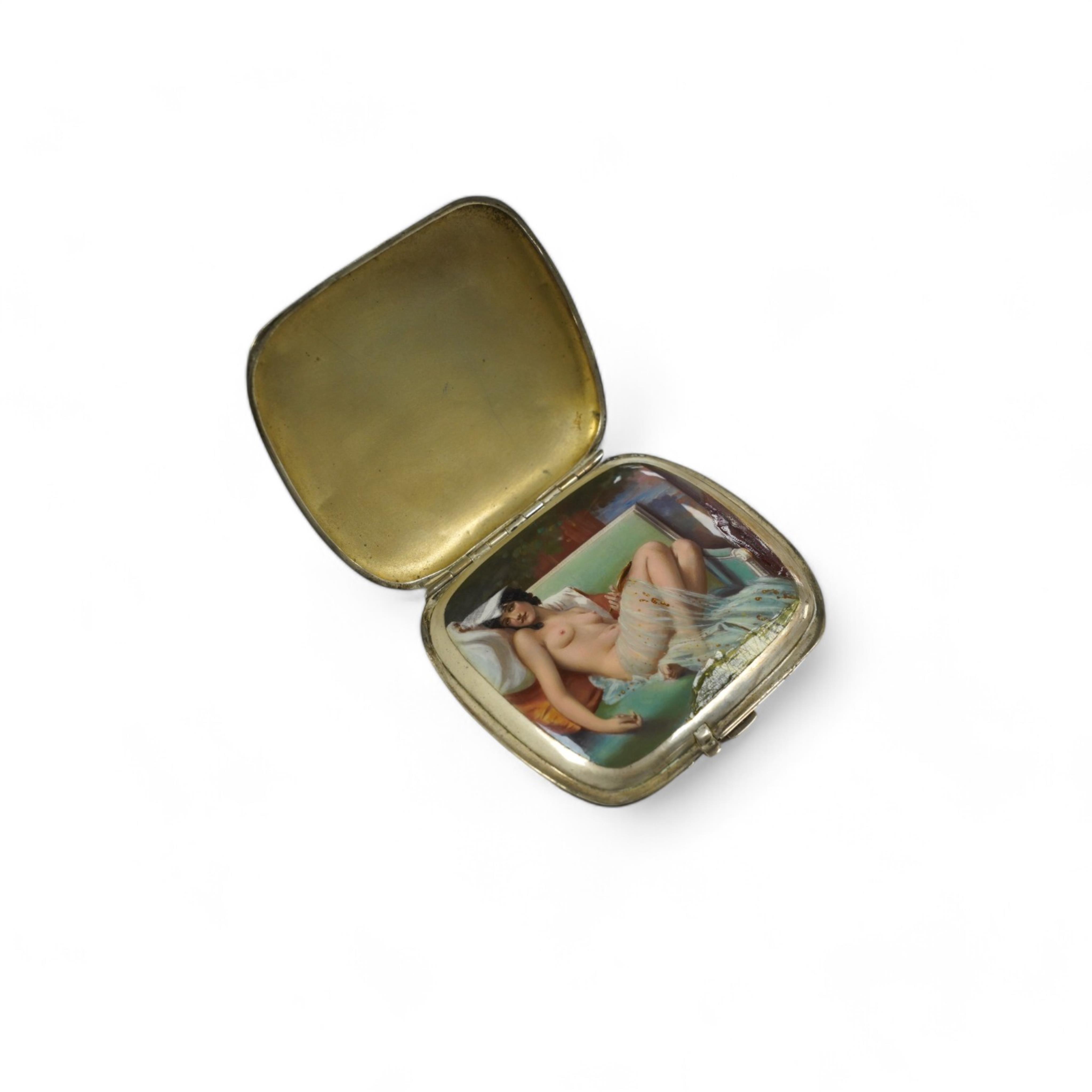 A 1920's/1930's German? 935 standard white metal cigarette case, with interior cover enamelled with a reclining nude (enamelled damaged and restored), 91mm, gross weight 6.1oz. Condition - poor